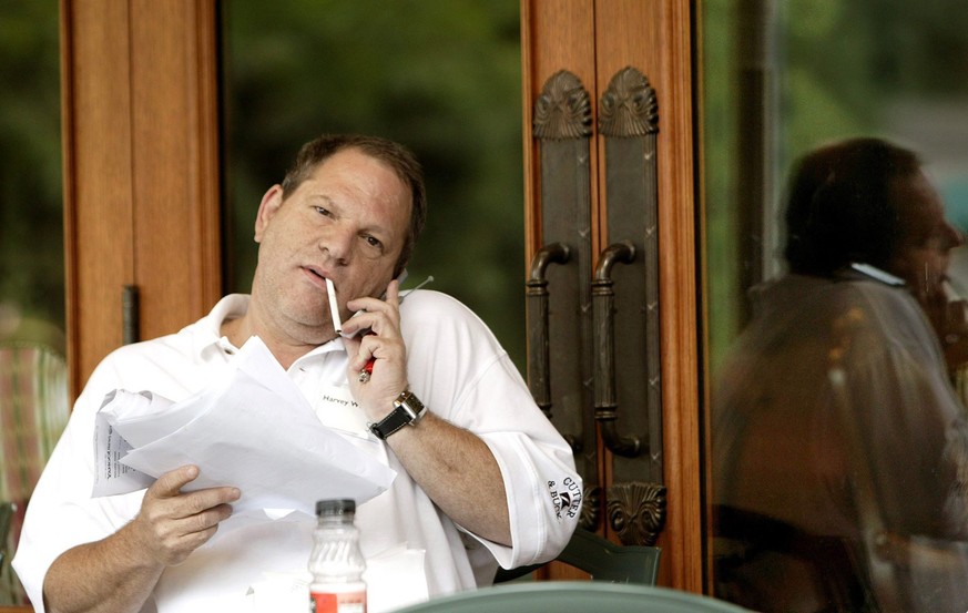 epa06254011 (FILE) - Harvey Weinstein, head of Miramax talks on his mobile phone at the third day of meeting at Allen and Company's 22nd Annual Media Conference in Sun Valley, Idaho, USA, 09 July 2004 ...