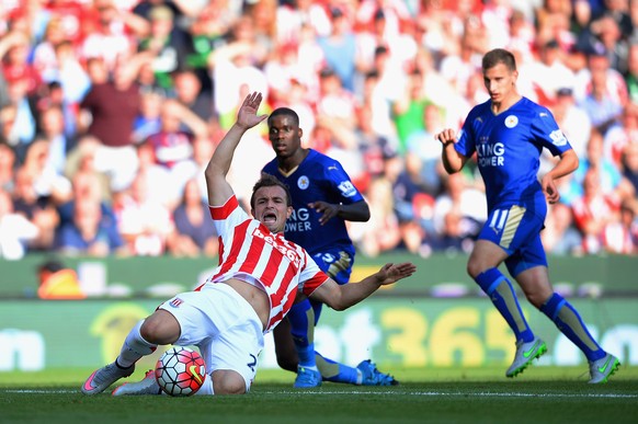 STOKE ON TRENT, ENGLAND - SEPTEMBER 19: Xherdan Shaqiri of Stoke City is brought down during the Barclays Premier League match between Stoke City and Leicester City at Britannia Stadium on September 1 ...