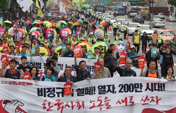 epa06703639 Members of the Korean Confederation of Trade Unions, a labor umbrella group, participate in a massive rally to mark Labor Day at Seoul Plaza in central Seoul, South Korea, 01 May 2018. EPA ...