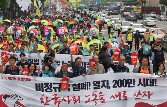 epa06703639 Members of the Korean Confederation of Trade Unions, a labor umbrella group, participate in a massive rally to mark Labor Day at Seoul Plaza in central Seoul, South Korea, 01 May 2018. EPA ...