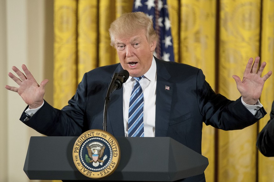 FILE - In this Sunday, Jan. 22, 2017, file photo, President Donald Trump speaks during a White House senior staff swearing-in ceremony in the East Room of the White House, in Washington. Trump’s econo ...