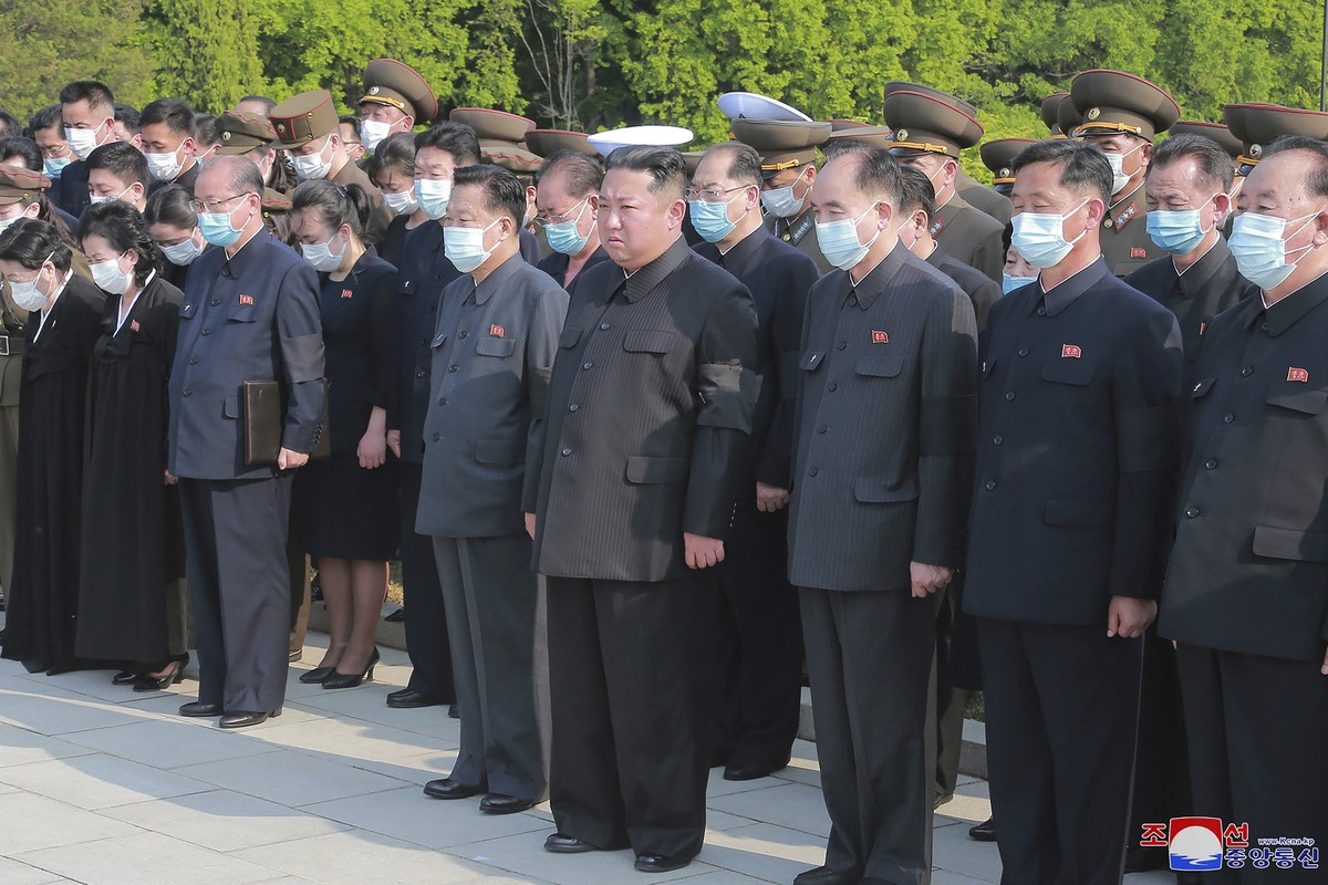 In this photo provided by the North Korean government, North Korean leader Kim Jong Un, center, attends a ceremony for Marshal of the Korean People's Army Hyon Chol Hae at a cemetery in Pyongyang ...