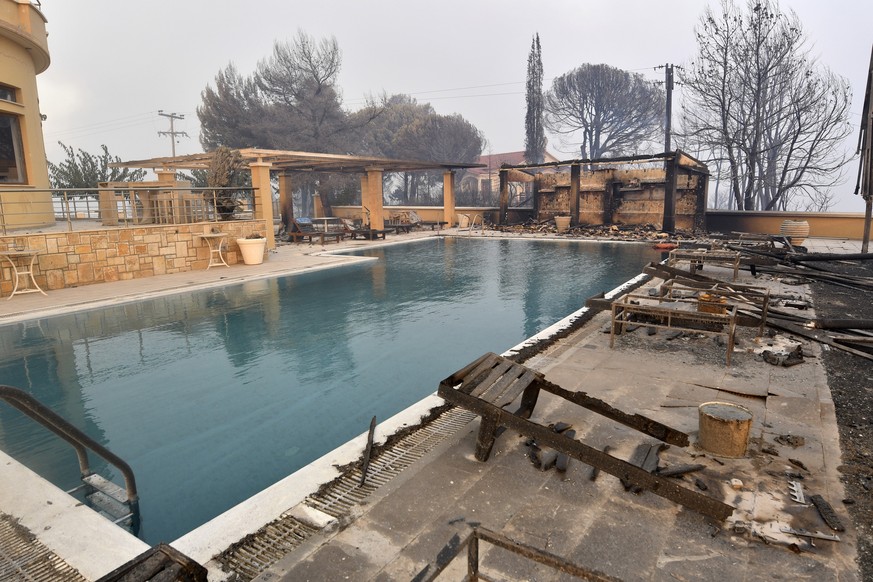 A burnt hotel during a wildfire in Lalas village, near Olympia town, western Greece, Thursday, Aug. 5, 2021. Wildfires rekindled outside Athens and forced more evacuations around southern Greece Thurs ...