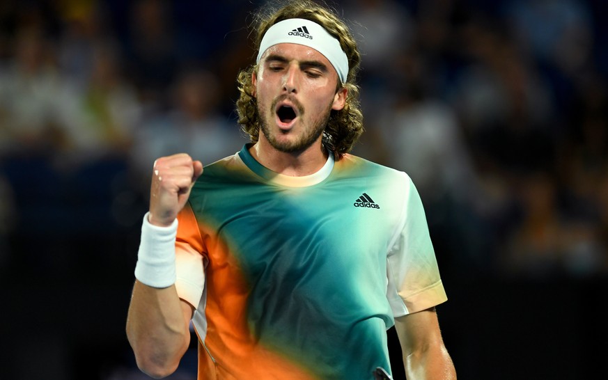 epa09706006 Stefanos Tsitsipas of Greece celebrates a point during his 4th round singles match against Taylor Fritz of the USA at the Australian Open Grand Slam tennis tournament at Melbourne Park, in ...