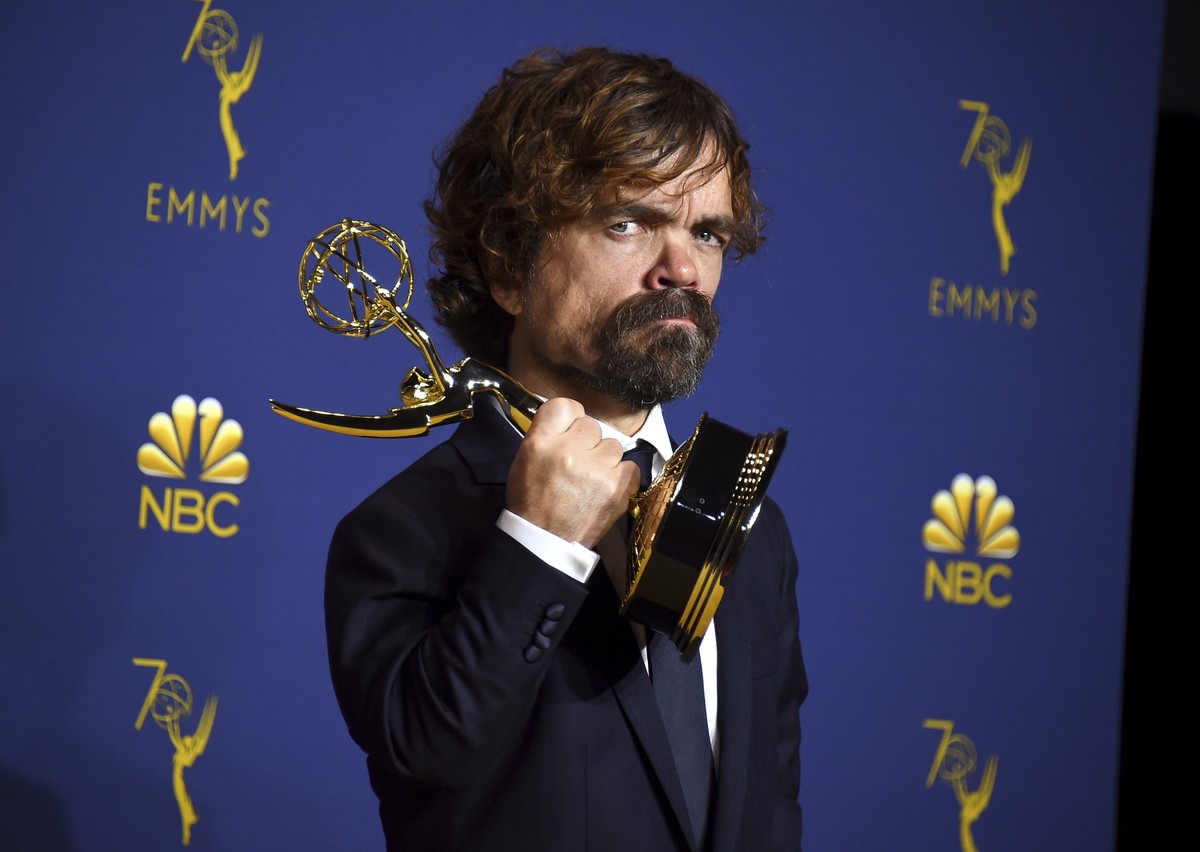 Peter Dinklage poses in the press room with the award for outstanding supporting actor in a drama series for "Game of Thrones" at the 70th Primetime Emmy Awards on Monday, Sept. 17, 2018, at ...