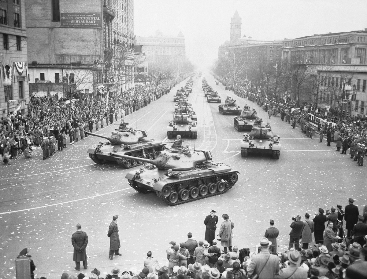 FILE - Army medium tanks move along Pennsylvania Avenue during the Inaugural Parade for President Dwight D. Eisenhower, Jan. 21, 1953, in Washington. Front tanks are turning into 15th Street on way to ...