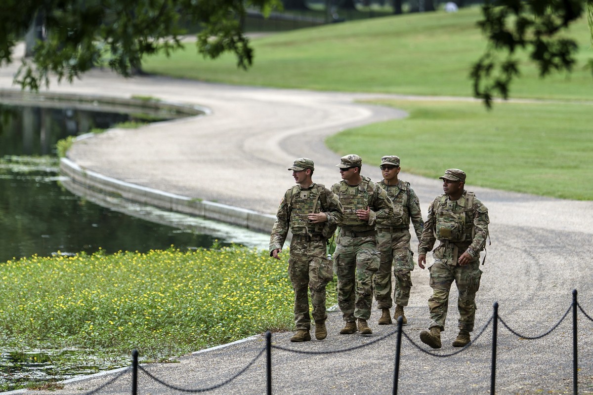 epa12313350 Members of the National Guard patrol the National Mall in Washington, DC, USA, 20 August 2025. As President Trump's takeover of Washington, DC, policing enters its second week, Missis ...