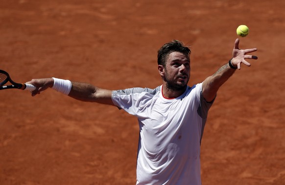 epa07617519 Stan Wawrinka of Switzerland plays Grigor Dimitrov of Bulgaria during their men’s third round match during the French Open tennis tournament at Roland Garros in Paris, France, 01 June 2019 ...