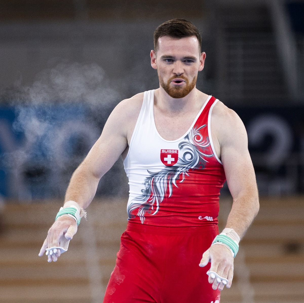 Benjamin Gischard of Switzerland reacts after his performance at the horizontal bar during the men's artistic gymnastics qualification at the 2020 Tokyo Summer Olympics in Tokyo, Japan, on Saturd ...