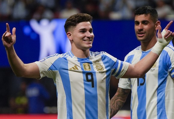 Argentina&#039;s Julian Alvarez celebrates scoring the opening goal against Canada during a Copa America Group A soccer match in Atlanta, Thursday, June 20, 2024. (AP Photo/Mike Stewart)