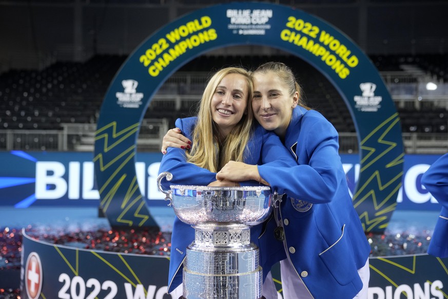 Switzerland&#039;s players Jil Teichmann and Belinda Bencic, right, pose with their trophy after defeating Australia to win the Billie Jean King Cup tennis finals, at the Emirates Arena in Glasgow, Sc ...