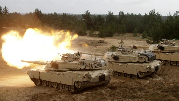 epa05357166 A U.S. Army Abrams tank fires during the Saber Strike military exercises in Adazi military exercise area, Latvia, June 11, 2016. Saber Strike is an annual U.S.-led exercise of land and air forces ...