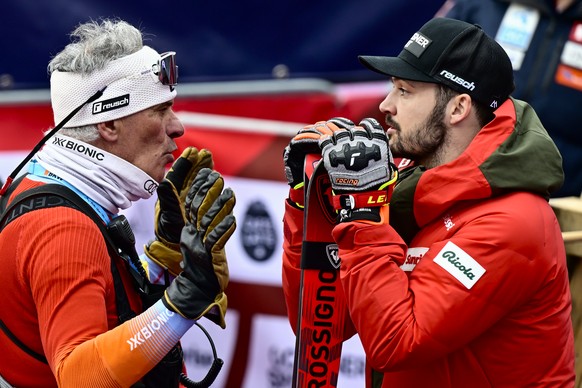 Thierry Meynet, coach for the Swiss-Ski Federation talks with Loic Meillard of Switzerland in the finish area during the second run of the men's Slalom race at the Alpine Skiing FIS Ski World Cup ...
