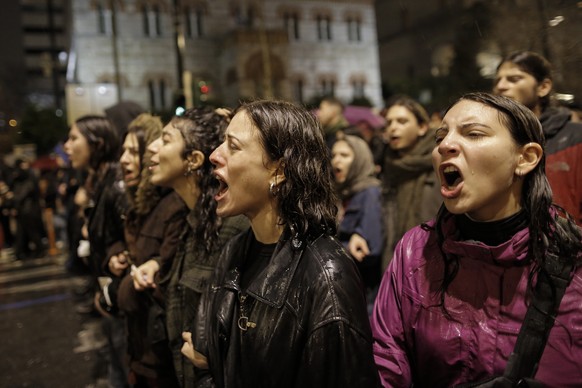 epa10499341 Youths shout slogans during a protest march in Athens, Greece, 2 March 2023, over the deadly train crash in central Greece. The death toll of the train collision that occurred on the Athen ...