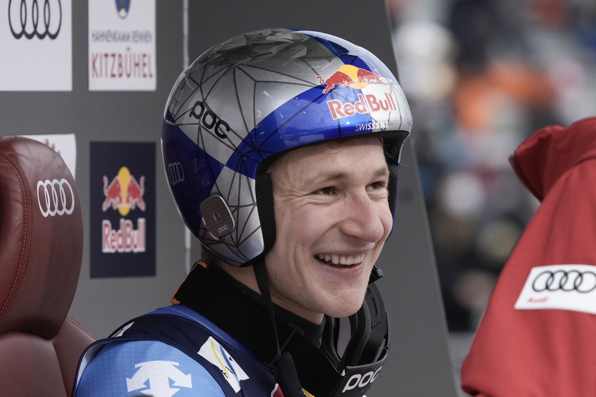 Switzerland's Marco Odermatt celebrates at the finish area of an alpine ski, men's World Cup downhill, in Kitzbuehel, Austria, Sunday, Jan. 23, 2022. (AP Photo/Giovanni Auletta)