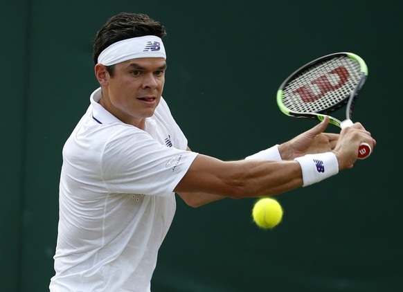 Canada&#039;s Milos Raonic returns the ball to Russia&#039;s Mikhail Youzhny during their Men&#039;s Singles Match on day four at the Wimbledon Tennis Championships in London Thursday, July 6, 2017. ( ...