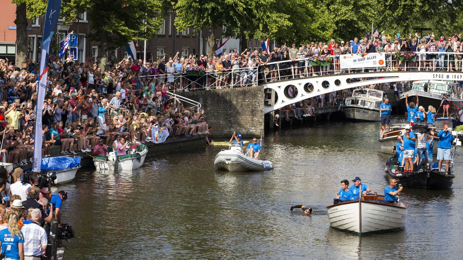 epa07670130 Dutch Former World Champion Maarten van der Weijden swims during his second attempt to swim along the Elfstedentocht, a journey of over 200 kilometers in Leeuwarden in a circular route, in ...