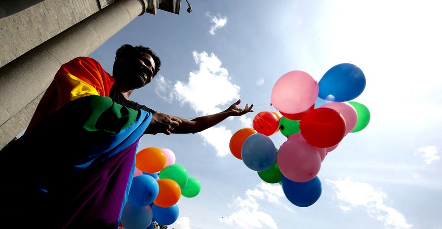 epa07000906 Indian activists of the lesbian, gay, bisexual, and transgender (LGBT) community celebrate after hearing the Supreme Court verdict, Bangalore, India, 06 September 2018. India&#039;s Suprem ...