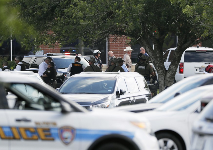 Emergency responders from multiple agencies work at the scene in front of Santa Fe High School in response to a shooting on Friday, May 18, 2018, in Santa Fe, Texas. (Kevin M. Cox /The Galveston Count ...