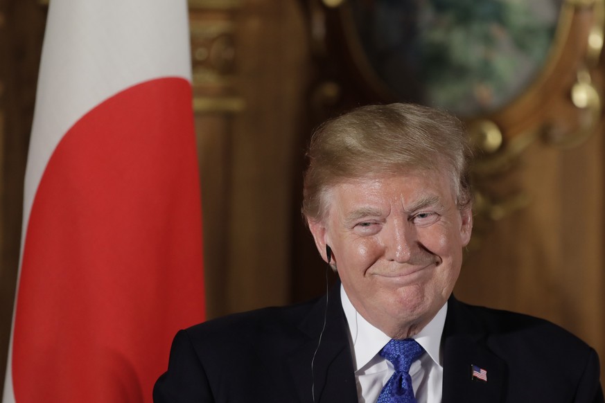 President Donald Trump speaks, accompanied by Japanese Prime Minister Shinzo Abe during a joint news conference at the Akasaka Palace, Monday, Nov. 6, 2017, in Tokyo. Trump is on a five country trip t ...