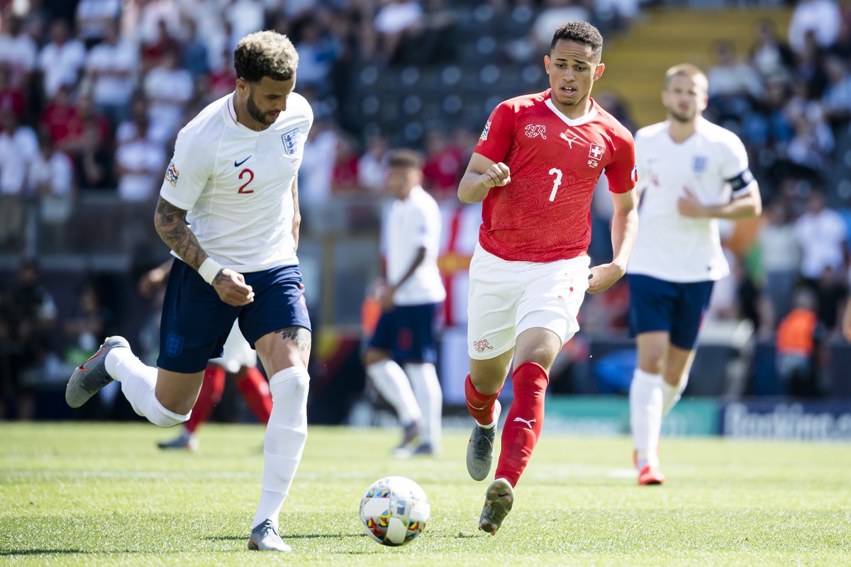 England's defender Kyle Walker, left, fights for the ball with Switzerland's midfielder Noah Okafor, right, during the UEFA Nations League third place soccer match between Switzerland and En ...