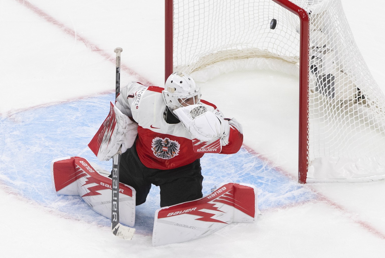 Austria goalie Sebastian Wraneschitz gives up a goal to Sweden during the second period of an IIHF World Junior Hockey Championship game in Edmonton, Alberta, Monday, Dec. 28, 2020. (Jason Franson/The ...