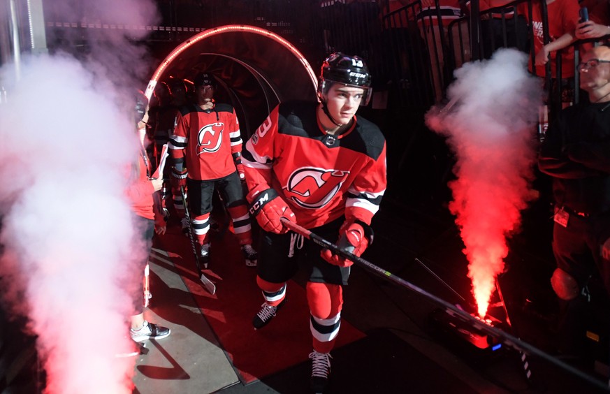 New Jersey Devils center Nico Hischier comes onto the ice before an NHL hockey game against the Colorado Avalanche Saturday, Oct. 7, 2017, in Newark, N.J. (AP Photo/Bill Kostroun)