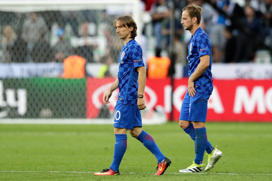 Croatia&#039;s Luka Modric, left, and Ivan Rakitic leave the pitch at the end of the Euro 2016 Group D soccer match between the Czech Republic and Croatia at the Geoffroy Guichard stadium in Saint-Eti ...