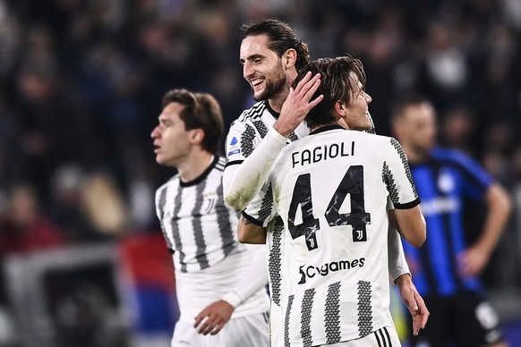 Juventus' Nicolo Fagioli, right, celebrates after scoring his team's second goal, with Juventus' Adrien Rabiot, center, during the Serie A soccer match between Juventus and Inter at Juventus Stadium,  ...