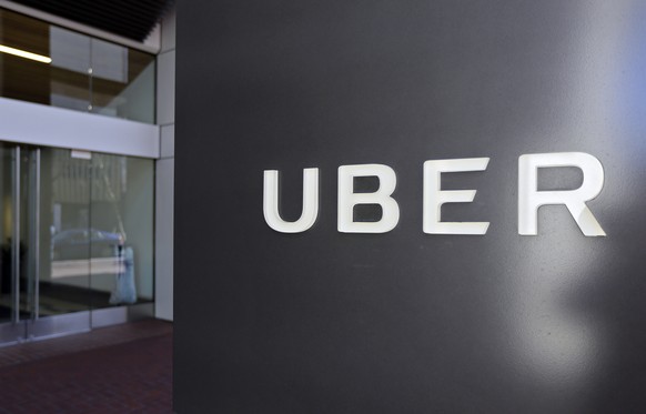 FILE- This March 1, 2017, file photo shows an exterior view of the headquarters of Uber in San Francisco. Uber has fired more than 20 employees after a law firm investigated complaints of sexual haras ...