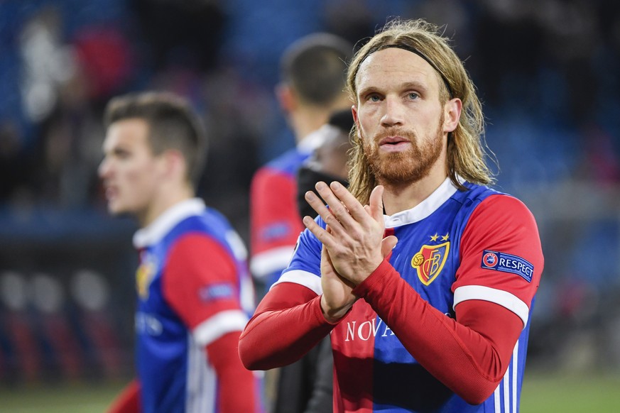 A sad looking Michael Lang of FC Basel acknowledges the fans after the UEFA Champions League round of sixteen first leg soccer match between Switzerland&#039;s FC Basel 1893 and England&#039;s Manches ...