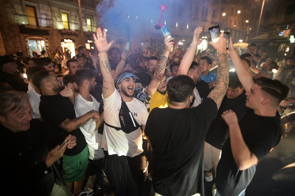 Napoli fans celebrate their team's win over Juventus in the Italian Cup soccer final against Juventus, in Naples, Italy, Wednesday, June 17, 2020. Napoli won the Italian Cup with a 4-2 penalty shootou ...