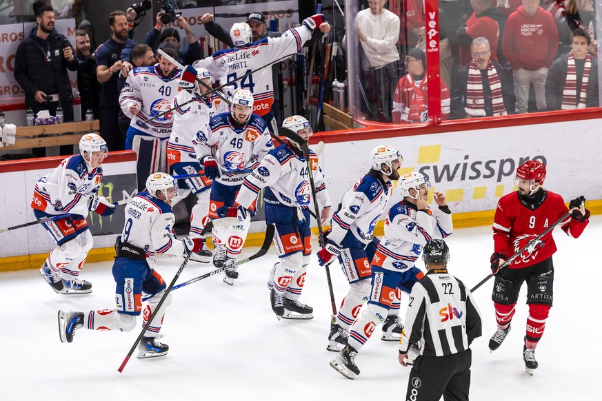 Lions&#039; players celebrate as Swiss Champion after winning by 2:3 the fifth leg of the ice hockey National League Swiss Championship final playoff game between Lausanne HC, LHC, and ZSC Lions, ZSC, ...