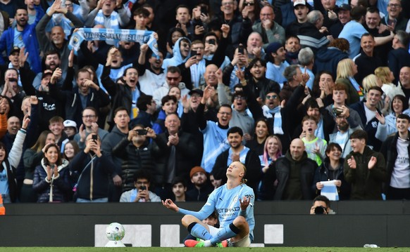 epa12900794 Manchester City's Erling Haaland celebrates after scoring for the 2-1 goal during the English Premier League match Manchester City against Arsenal FC, in Manchester, Britain, 19 April ...