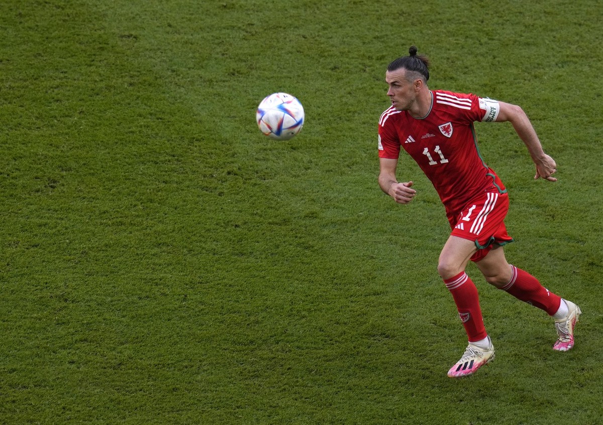Wales' Gareth Bale controls the ball during the World Cup group B soccer match between Wales and Iran, at the Ahmad Bin Ali Stadium in Al Rayyan , Qatar, Friday, Nov. 25, 2022. (AP Photo/Manu Fer ...