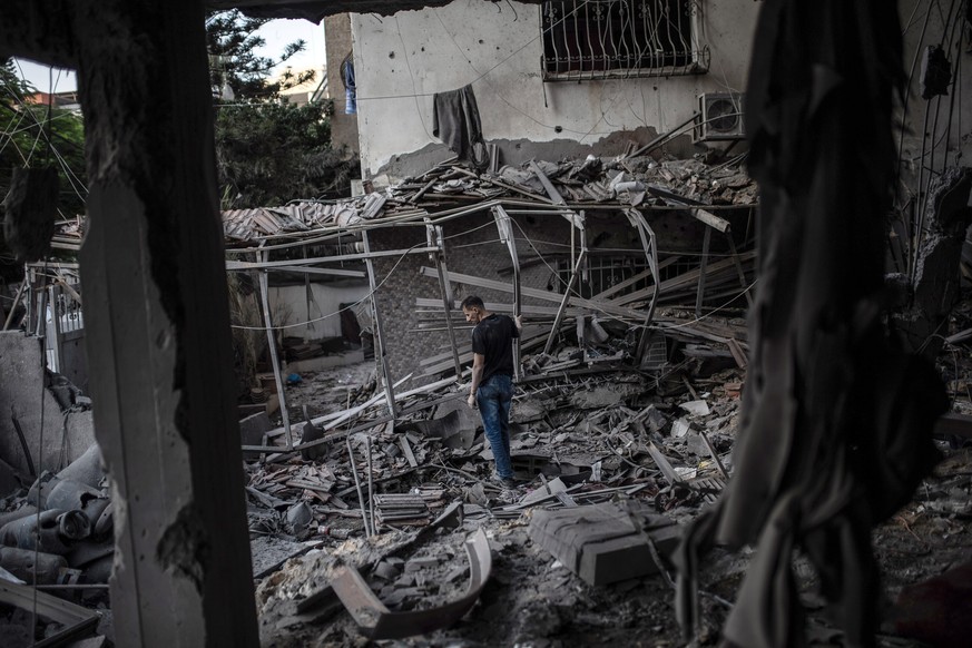 epa13278177 A Palestinian inspects the rubble of a residential apartment following an Israeli air strike in the west of Gaza City on 03 October 2026. According to the Ministry of Health in Gaza, at le ...
