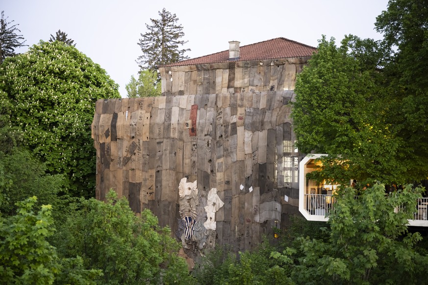 epa12067743 An art installation by Ghanaian artist Ibrahim Mahama made of recycled jute sacks from the cocoa trade, highlighting colonial legacies and global ties between Ghana and Switzerland, covers ...