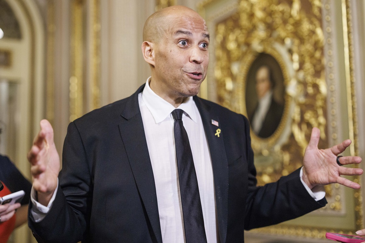 epa12004152 US Senator Cory Booker (Democrat of New Jersey) speaks to the media off the Senate floor after completing a record-breaking 25-hour, 5-minute filibuster in opposition to US President Trump ...