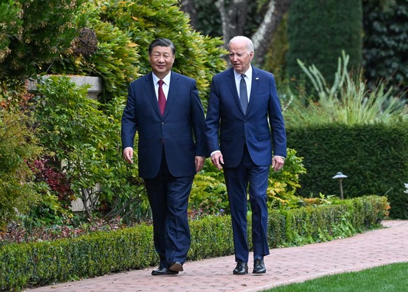 epa10977854 US President Joe Biden (R) and Chinese President Xi Jinping take a walk after their talks in the Filoli Estate in Woodside, south of San Francisco, California, USA, 15 November 2023 (issue ...