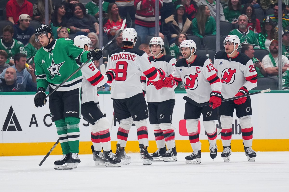 New Jersey Devils center Nico Hischier (13) celebrates after scoring a goal against the Dallas Stars during the first period of an NHL hockey game Tuesday, Oct. 27, 2026, in Dallas. (AP Photo/Julio Co ...