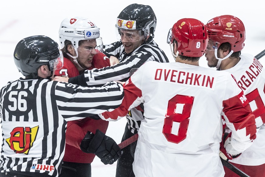 Switzerland&#039;s Nico Hischier, left, fights against Russia`s Alexander Ovechkin during the game between Switzerland and Russia, at the IIHF 2019 World Ice Hockey Championships, at the Ondrej Nepela ...