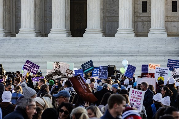 epa09614791 Pro Life and Pro Choice activists protests outside of the US Supreme Court as the high court prepares to hear arguments in a challenge to an abortion law in Mississippi that is a direct ch ...