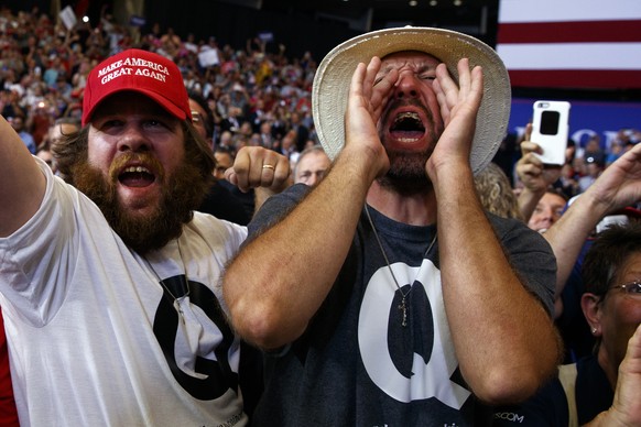 Supporters of President Donald Trump cheer as he arrives for a campaign rally, Wednesday, June 27, 2018, in Fargo, N.D. (AP Photo/Evan Vucci)