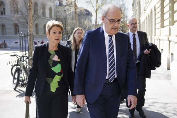 epa12007482 Swiss Federal President Karin Keller-Sutter (L) and Federal Councillor Guy Parmelin arrive for a press conference on the new import tariffs into the US, in Bern, Switzerland, 03 April 2025 ...
