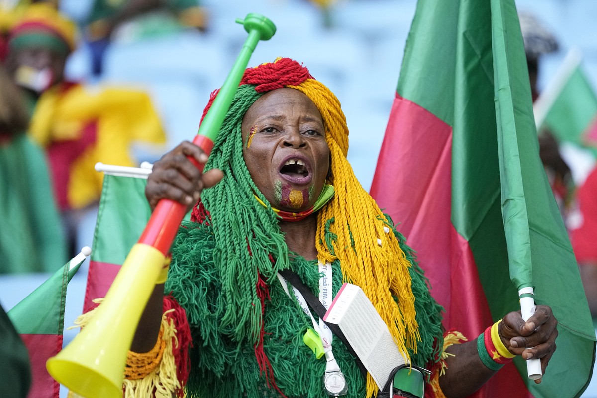 A Cameroon supporter cheers prior to the World Cup group G soccer match between Switzerland and Cameroon, at the Al Janoub Stadium in Al Wakrah, Qatar, Thursday, Nov. 24, 2022. (AP Photo/Ebrahim Noroo ...