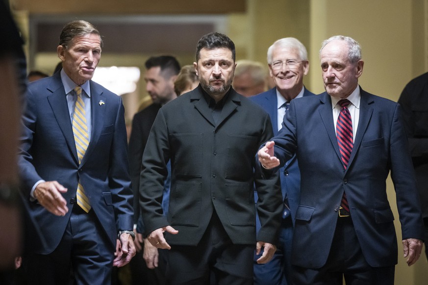 epaselect epa13138470 Ukrainian President Volodymyr Zelenskyy (C) arrives for a meeting with US senators at the US Capitol in Washington, DC, USA, 28 July 2026. Zelenskyy visited Washington to attend  ...