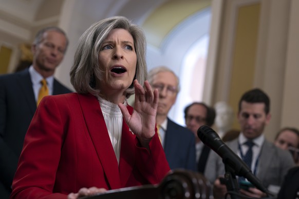 Sen. Joni Ernst, R-Iowa, and other Republicans criticize President Joe Biden as they speak to reporters at the Capitol in Washington, Wednesday, June 12, 2024. The GOP lawmakers will meet with former  ...