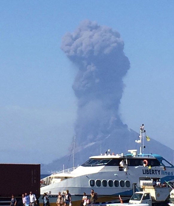 epa07692553 Ash rises into the sky after a volcano eruption on a small island of Stromboli, Italy, 03 July 2019. According to reports, the island of Stromboli was hit by a set of violent volcano erupt ...