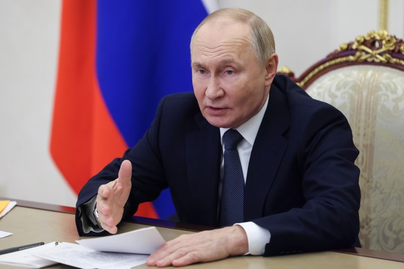 Russian President Vladimir Putin holds a meeting on economic issues via videoconference at the Kremlin in Moscow, Russia, Monday, Oct. 28, 2024. (Mikhail Metzel, Sputnik, Kremlin Pool Photo via AP)w