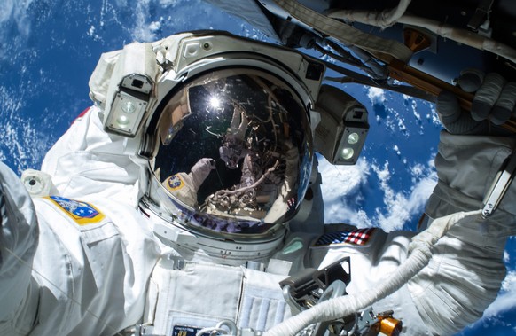 epa04636092 A handout picture made available by NASA on 25 February 2015 shows US NASA astronaut Barry Wilmore operating outside the International Space Station (ISS) on the first of three spacewalks  ...